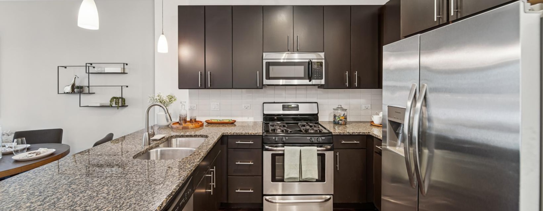 a kitchen with black cabinets