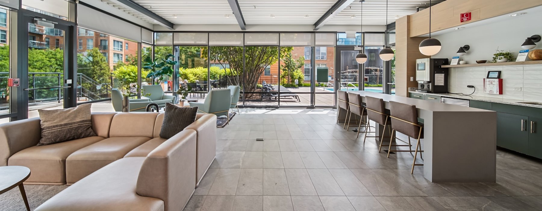 a clubroom with a bar and chairs